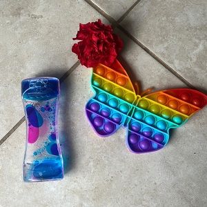 this includes a satisfying pink and blue sensory, a rainbow butterfly pop it.